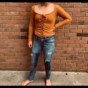 Tight mustard yellow long sleeve shirt